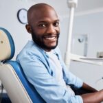 man in dental chair, full mouth restoration