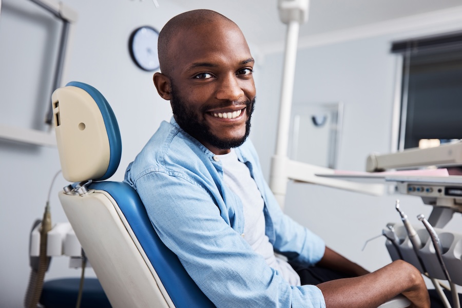 man in dental chair, full mouth restoration