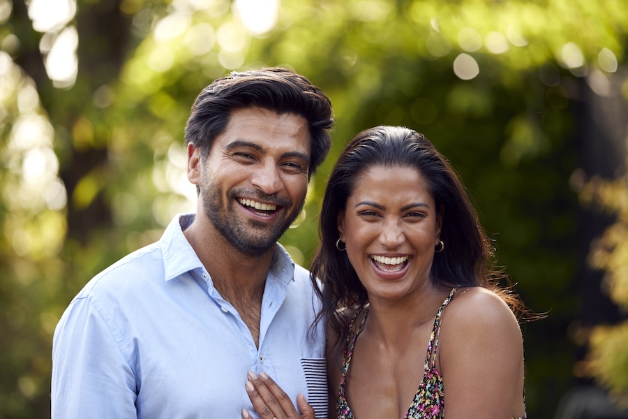 couple smiling after cosmetic bonding on their chipped teeth