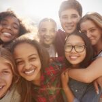 group of teens considering invisalign for teens or clear aligners for teens
