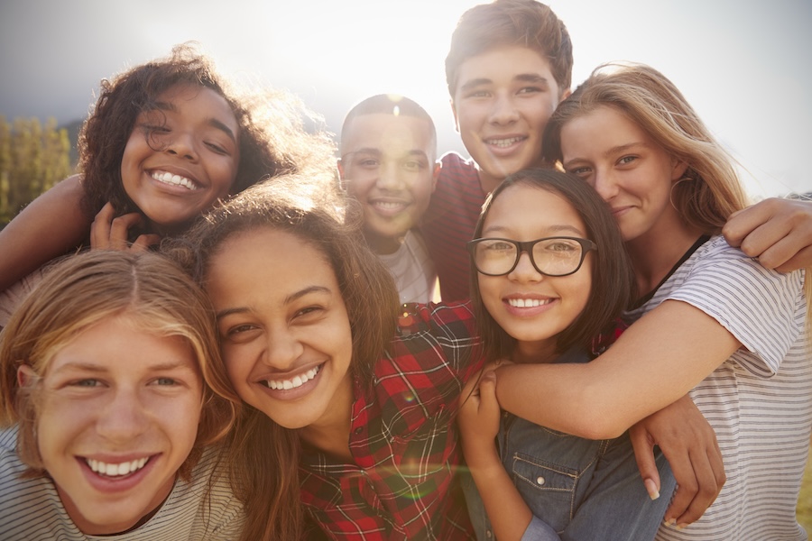 group of teens considering invisalign for teens or clear aligners for teens