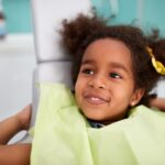child in dental chair at family dentist