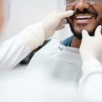 man at dentist discussing professional teeth whitening options